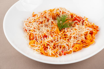 pasta with cheese in a white plate