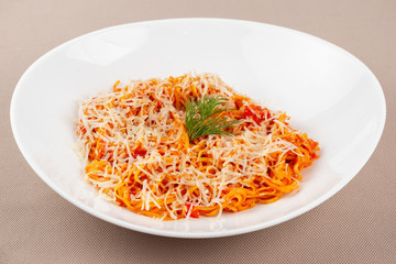 pasta with cheese in a white plate