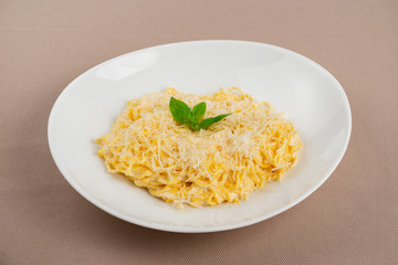 pasta with cheese in a white plate