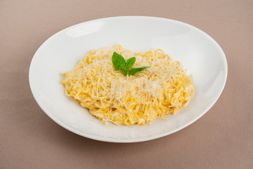 pasta with cheese in a white plate