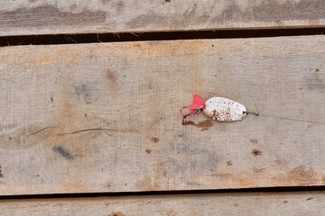 fishing tackle on wooden background