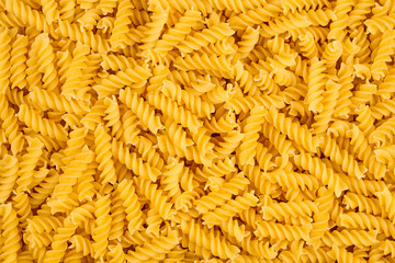 texture of raw spirelli noodles pasta italian food macro background