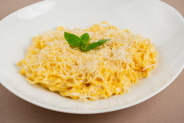 pasta with cheese in a white plate