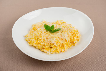 pasta with cheese in a white plate