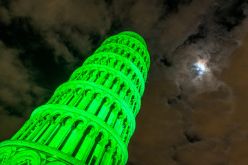 Pisa Tower for St Patrick's Day with the moon in the sky
