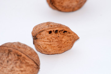 Several walnuts isolated on white background close-up macro