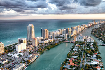 Skyscrapers of Miami Beach. Stunning aerial view at sunset with cloudy sky