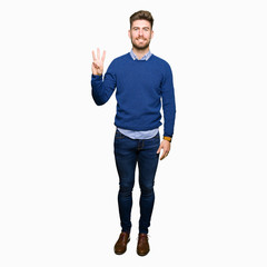 Young handsome bussines man showing and pointing up with fingers number three while smiling confident and happy.