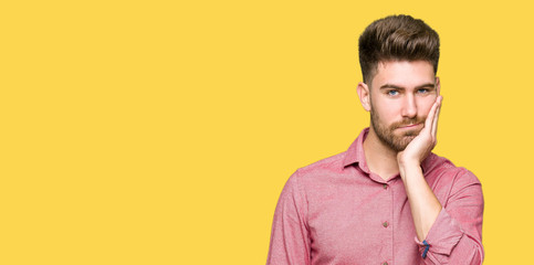 Fototapeta premium Young handsome business casual man thinking looking tired and bored with depression problems with crossed arms.