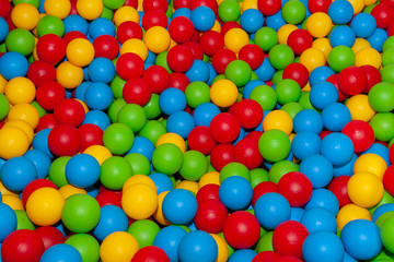 Fototapeta na wymiar Background of many colored plastic balls.