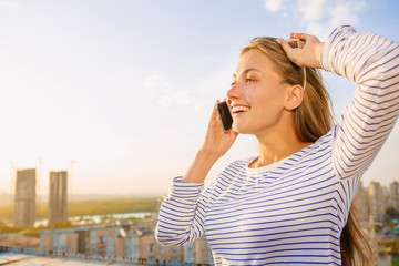 Beautiful young woman on the rooftop