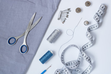 Sewing accessories and accessories for needlework in gray-blue shades.