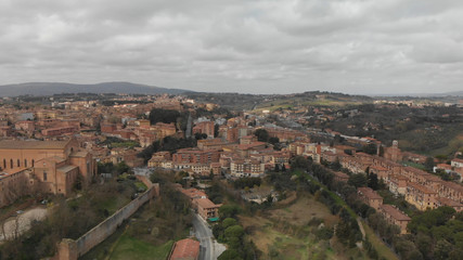 Fototapeta na wymiar Siena, Tuscany. Beautiful aerial city skyline from surrounding hills
