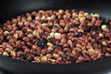 roasted peanuts in a frying pan