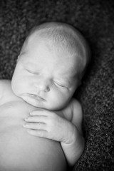 Newborn Baby Sleeping Peacefully - Black and White Infant Portrait
