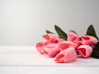 Fototapeta na wymiar Spring tulips flowers on a old wooden