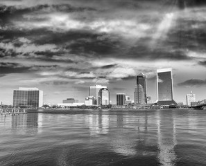 Downtown Jacksonville and St Johns River from Southbank Riverwalk. Beautiful water reflections on a sunny day