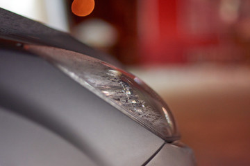 Detail photo of headlights of a car