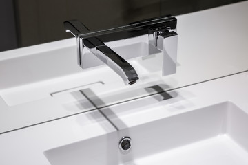 Modern, wall mounted basin tap