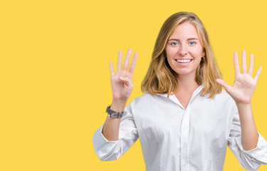 Beautiful young business woman over isolated background showing and pointing up with fingers number...