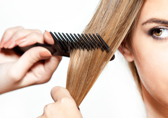 Combing hair, female