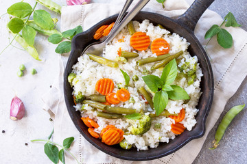 Healthy food: rice with vegetables. Diet vegan menu. Top view flat lay background.