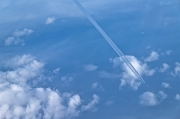 Airplane and Contrails at high altitude