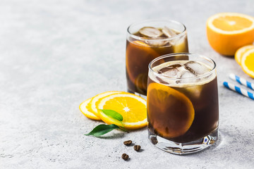 Orange spiced cold brew coffee. Selective focus, space for text.