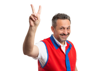 Hypermarket employee showing peace or victory sign.