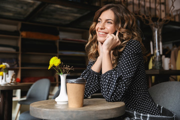 Smiling young woman using mobile phone