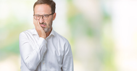 Handsome middle age elegant senior business man wearing glasses over isolated background thinking looking tired and bored with depression problems with crossed arms.