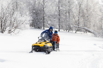 Athlete on a snowmobile.