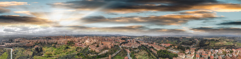 Fototapeta na wymiar Amazing panoramic aerial view of Siena medieval skyline at sunset, Tuscany.
