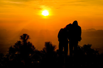 Black silhouette Phu Kradueng National Park at sunrise in Loei,Thailand