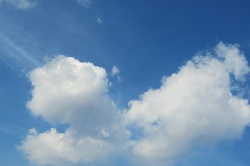 Naklejka na ściany i meble Fluffy clouds in blue sky, natural background
