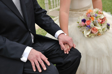 bride and groom holding hands ready to receive the marriage blessing