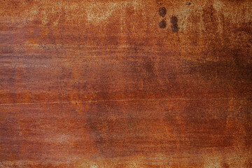 Grunge rusted metal texture. Rusty corrosion and oxidized background. Worn metallic iron panel. Abandoned design wall. Copper bar.