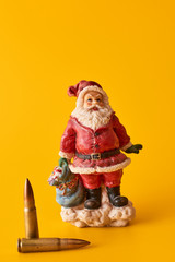 Concept New Year crime. Santa and bullets