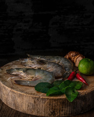 Fresh shrimp or raw shrimp on a wooden board prepared to make Tom Yum Kung menu