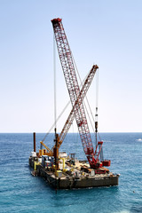 Fototapeta premium cranes on floating platform