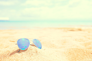 Fototapeta na wymiar Sunglasses on the beach.