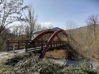 Fototapeta na wymiar old wooden bridge over the river