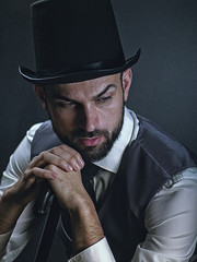 The gentleman. Dramatic male portrait with classic light and retro dress