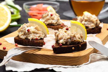 minced herring fillet with apple and egg on toasted rye bread, homemade traditional Jewish cuisine dish forshmak, snack or appetizer