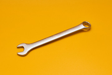 wrench isolated on yellow background