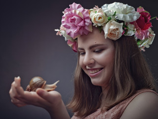 Funny teen with his snail pal. Female portrait