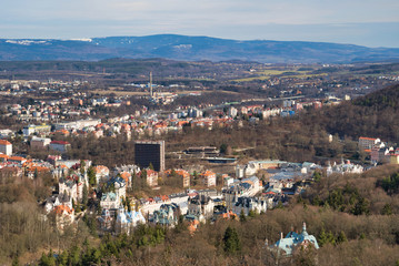 Fototapeta na wymiar Karlovy Vary, Czech Republic - March 04, 2019: Aerial view of the city and the mountains on the horizon