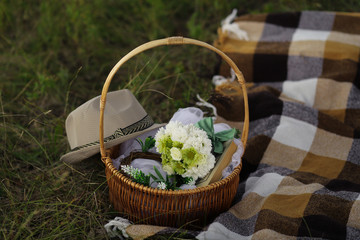 Fototapeta na wymiar basket with flowers on wooden table