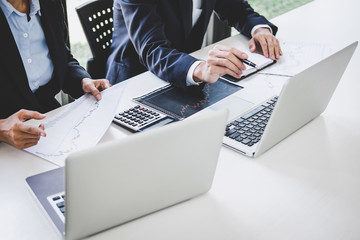 Business team investment working with computer and analysis graph stock market trading with stock...