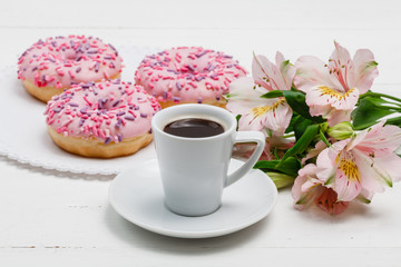 Coffee for breakfast with glazed donuts